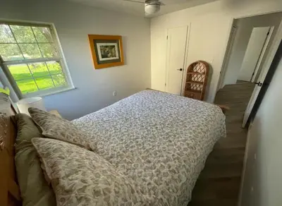 a bedroom with a bed and a window at Executive Ranch near Old Town in Fort Collins