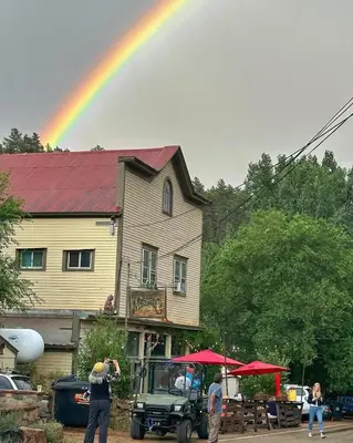 a police officer taking a picture of a rainbow at River Mountain Getaway-private, large, in- law apt in Jamestown