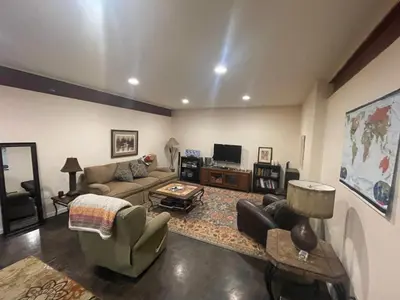 a living room with a couch and a table at River Mountain Getaway-private, large, in- law apt in Jamestown