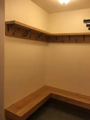 a room with a wooden shelf on the wall at Large Winter Park Condo overlooking Hideaway Park! in Hideaway Park