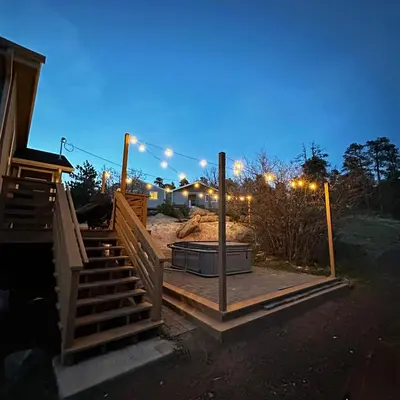 a house under construction at night with lights at Near Red Rocks with Hot Tub, Fire Pit and Views in Indian Hills
