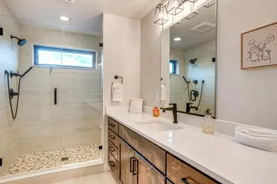 a bathroom with a sink and a shower at Private Hot Tub and Patio Granby Mtn Retreat! in Granby