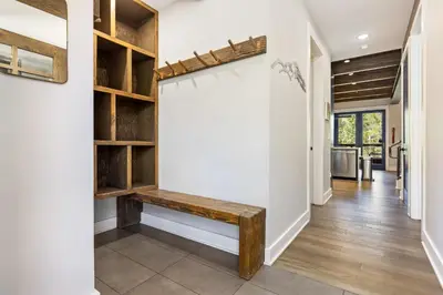 a hallway with a bench in a house at 1824 The Seasons townhouse in Keystone