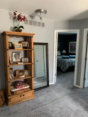 a room with a mirror and a book shelf at Charming 3 bed 3 bath home, super cozy, close to DIA in Altura