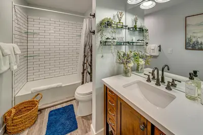 a bathroom with a sink and a toilet and a shower at Ski Retreat with Hot Tub Access in Winter Park! in Winter Park