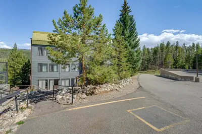 an empty parking lot in front of a house at Ski Retreat with Hot Tub Access in Winter Park! in Winter Park