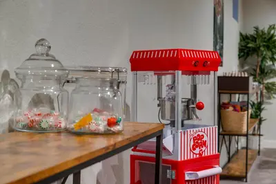 a counter with two glass jars filled with candy at Mid Summer Night's Dream w Hot Tub Theater Game Room in Arvada