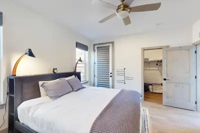 a bedroom with a bed with a ceiling fan at Rendezvous Retreat in Fraser