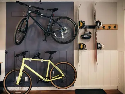 a bike hanging on a wall in a room at LOGE Breckenridge in Gold Hill