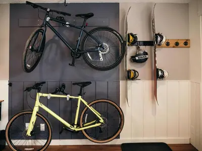 a bike hanging on a wall in a room at LOGE Breckenridge in Gold Hill