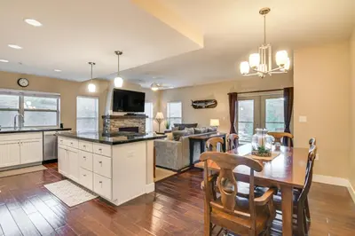 a kitchen and living room with a wooden table and chairs at Ski-InandSki-Out and Pool Access Granby Ranch Gem in Granby