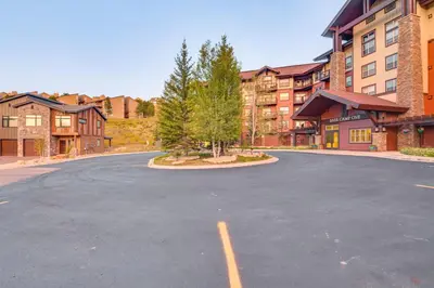 an empty parking lot in front of a building at Ski-InandSki-Out and Pool Access Granby Ranch Gem in Granby