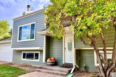 a house with a pumpkins in front of it at Bright Home - Huge Backyard 20 min - Denver & Boulder in Broomfield