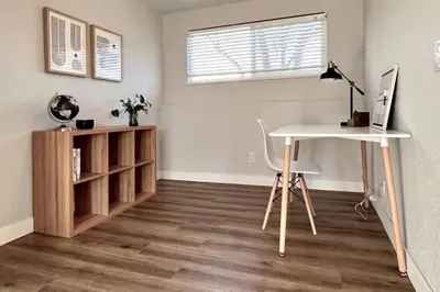 a room with a desk and a table and a chair at Bright Home - Huge Backyard 20 min - Denver & Boulder in Broomfield