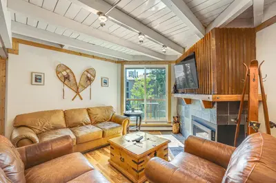 a living room with a couch and a fireplace at Mtn-View Condo with Community Perks in Silverthorne in Silverthorne