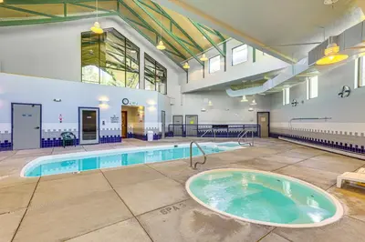 a large indoor swimming pool with a hot tub at Mtn-View Condo with Community Perks in Silverthorne in Silverthorne