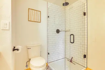 a bathroom with a toilet and a glass shower at Mtn-View Condo with Community Perks in Silverthorne in Silverthorne