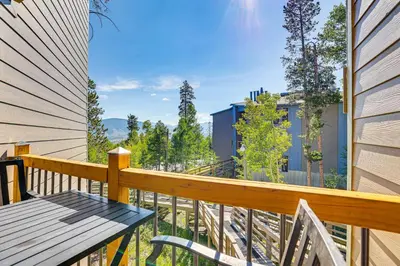 a wooden balcony with a wooden bench on it at Mtn-View Condo with Community Perks in Silverthorne in Silverthorne