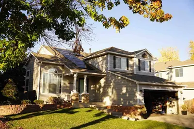 a white house with a roof at Charming Broomfield Home Close To Everything! in Broomfield