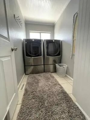a washer and dryer in a room with a rug at Charming Broomfield Home Close To Everything! in Broomfield