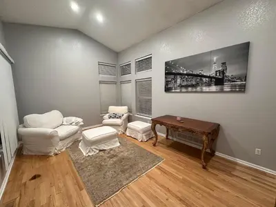 a living room with a couch and a table at Charming Broomfield Home Close To Everything! in Broomfield