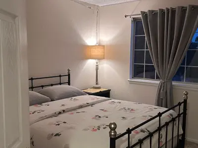 a bedroom with a bed and a window at Charming Broomfield Home Close To Everything! in Broomfield