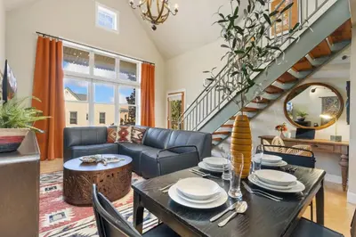 a living room with a table and chairs at Lee Martinez Loft Near Poudre Trail and Old Town in Fort Collins
