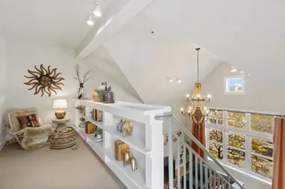 a staircase in a home with a white stair case at Lee Martinez Loft Near Poudre Trail and Old Town in Fort Collins