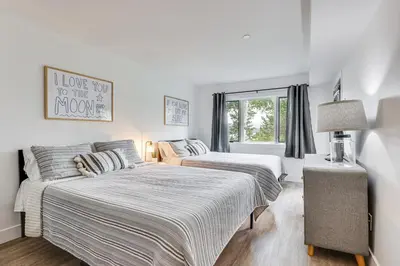a bedroom with two beds and a window at Patio and Dillon Reservoir Views Chic Frisco Condo! in Frisco