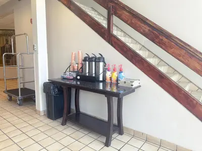 a table in a room with a staircase at Quality Inn & Suites Fort Collins East in Fort Collins