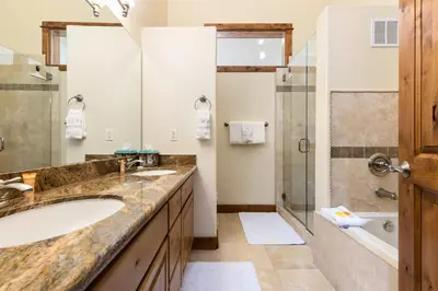 a bathroom with a sink and a shower at Antlers Gulch Retreat townhouse in Keystone