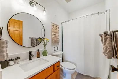 a bathroom with a sink and a mirror at Epic Views - Hot Tub - Starlink Internet - Dogs OK in Evergreen