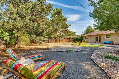 a group of lawn chairs sitting in a yard at Central Boulder Home with Outdoor Oasis, Walk to CU! in Boulder