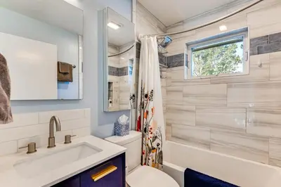 a bathroom with a toilet and a sink at Central Boulder Home with Outdoor Oasis, Walk to CU! in Boulder