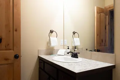 a bathroom with a sink and a mirror at Alluring Rocky MTN Getaway - Free Parking - Fraser in Fraser