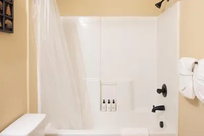 a white shower in a bathroom with a toilet at Alluring Rocky MTN Getaway - Free Parking - Fraser in Fraser