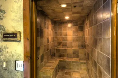 a walk in shower in a room with tiles at Timbers 3064 : 2 in Keystone