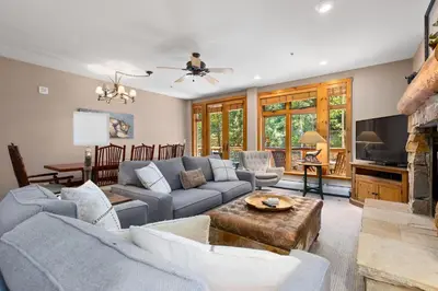 a living room with a couch and a table at Timbers 3064 : 2 in Keystone