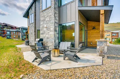 a house with two chairs and a table on a patio at Mtn-View Slopeside Chalet in Granby Ranch! in Granby