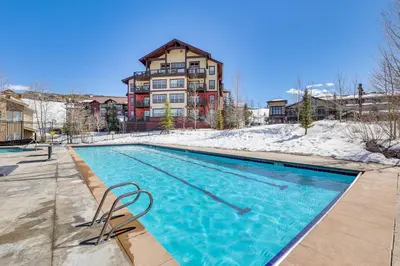a swimming pool in front of a building at Mtn-View Slopeside Chalet in Granby Ranch! in Granby