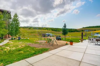 a park with a playground and a picnic table at Mtn-View Slopeside Chalet in Granby Ranch! in Granby