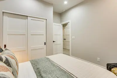 a bedroom with white walls and a bed at Hot Tub and Mtn-View Rooftop Deck Golden Home in Golden