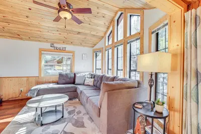 a living room with a couch and a ceiling fan at 4 Mi to Ski Resort Pet-Friendly Breck Cabin in Breckenridge