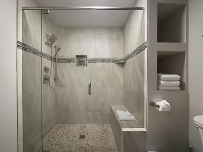a shower with a glass door in a bathroom at Luxury By The Lake in Dillon