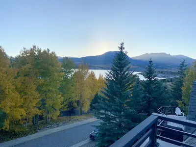 an aerial view of a road with trees and a house at Luxury By The Lake in Dillon