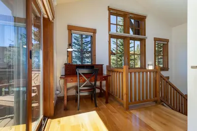 a home office with a desk and windows at 43 Thackwell condo in Keystone