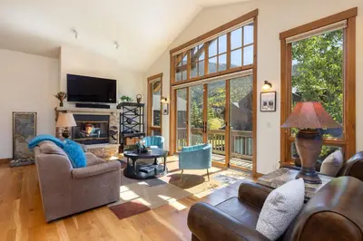 a living room with furniture and a fireplace at 43 Thackwell condo in Keystone