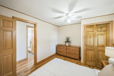 a bedroom with a ceiling fan and a dresser at Bright & Cozy House Centennial Littleton 4 Bed 3 Bath in Centennial