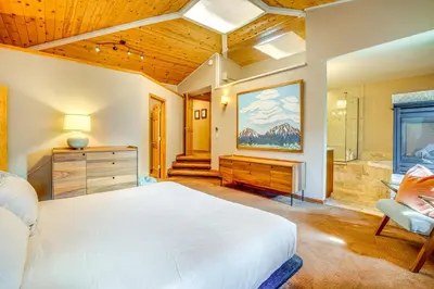 a bedroom with a bed and a bathroom with a tub at Mtn-View Frisco Home Near Skiing and Hiking! in Frisco