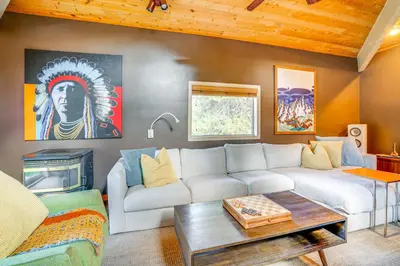 a living room with a couch and a table at Mtn-View Frisco Home Near Skiing and Hiking! in Frisco